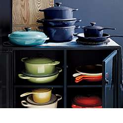 Assorted Le Creuset cookware in Caribbean, Ink, Palm, Flame, Cherry, Cream and Soleil colors