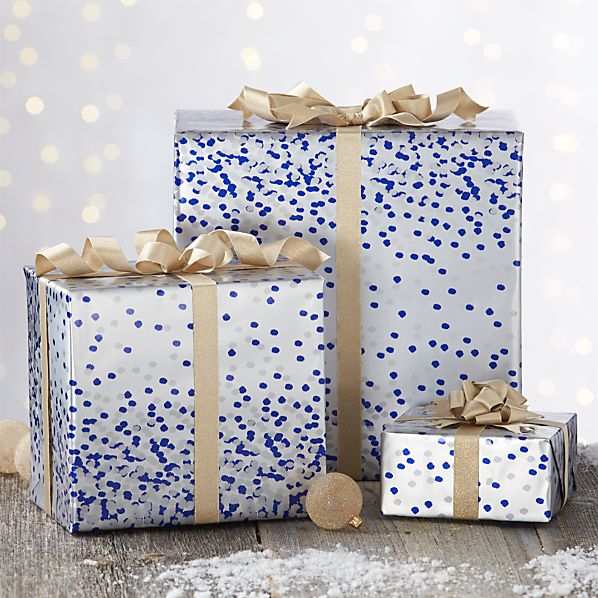 gifts wrapped in silver paper with blue polkadots