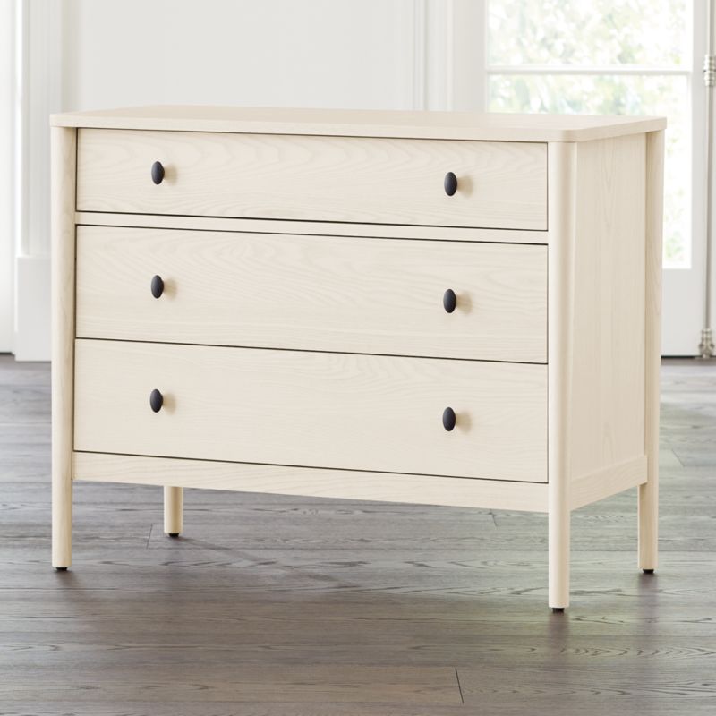 cream dresser and nightstand