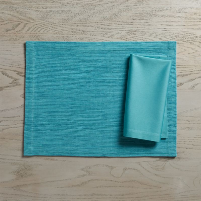 Grasscloth Aqua Placemat and Fete Aqua Cloth Napkin Crate and Barrel