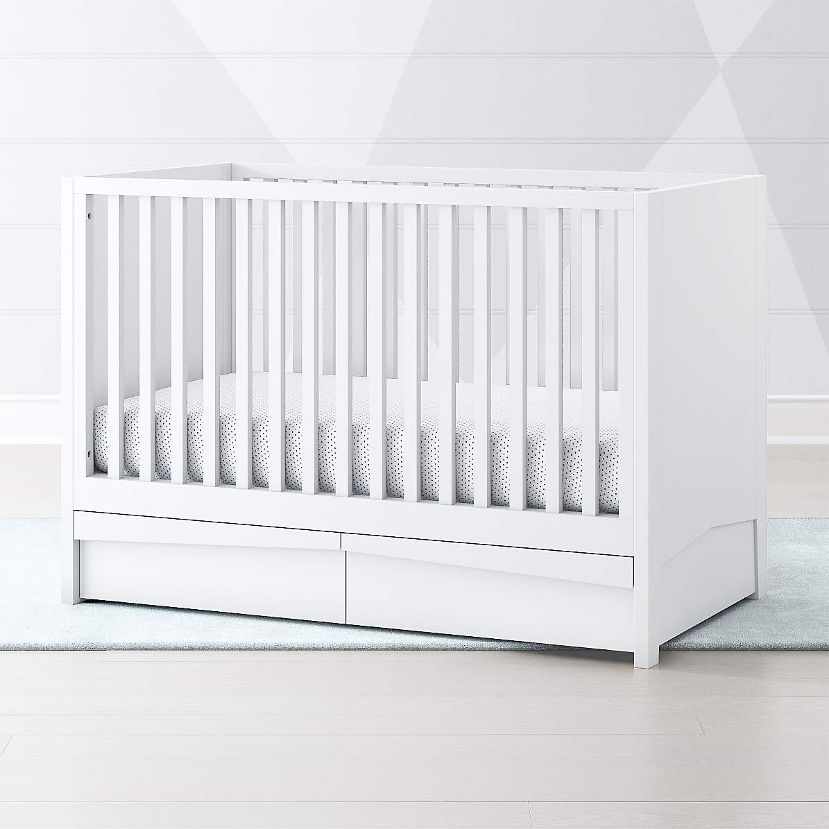 white crib with storage