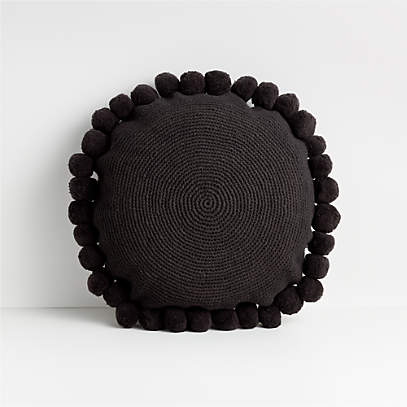 black pom pom pillow