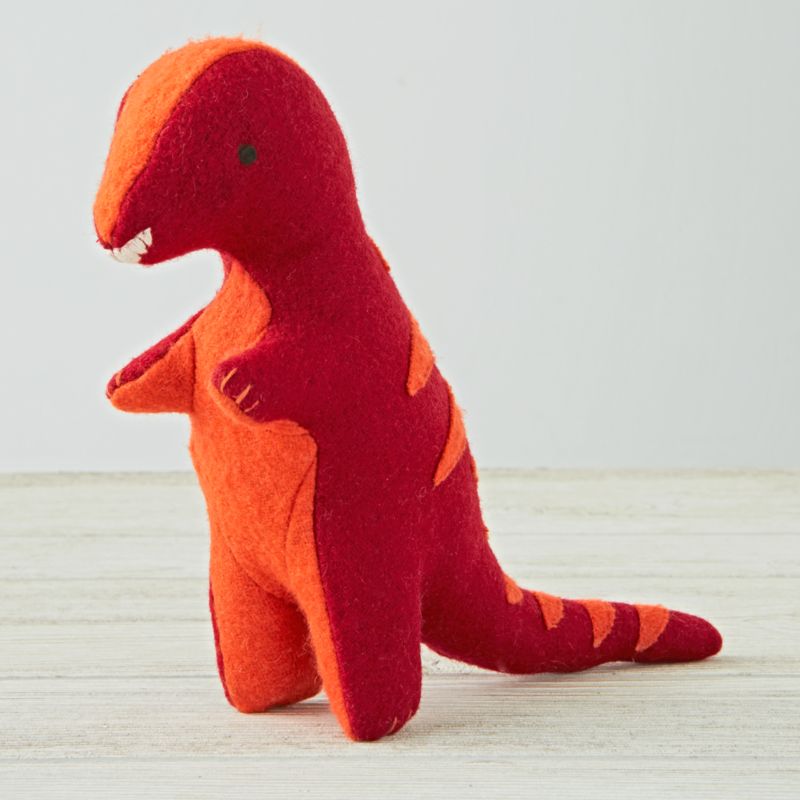 red stuffed dinosaur