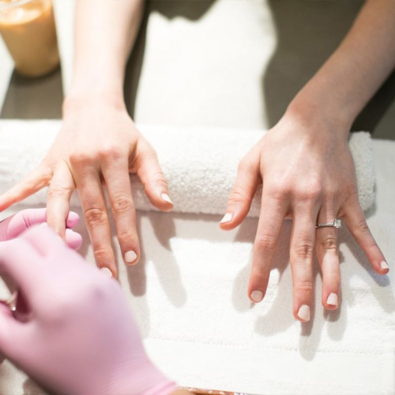 Attendee at manicure station