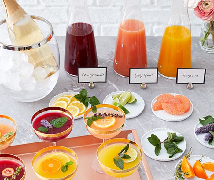  Drink station with juices, ice, and fruits.