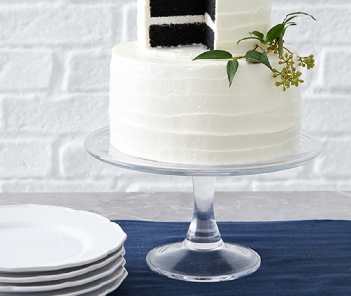 White cake on a clear stand.