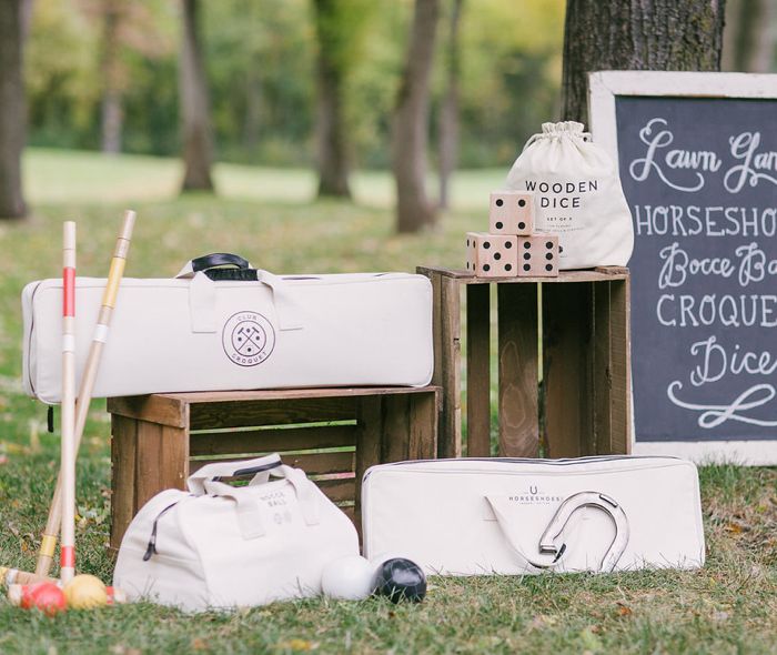 Bocce ball, horseshoes, lawn dice and croquet on a lawn.