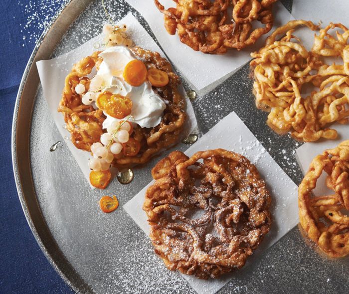 Potato latkes served with waffles and vodka.