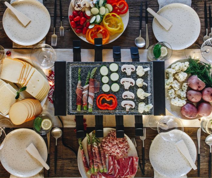 Fire up the Raclette Grill! This winter dinner experience will get