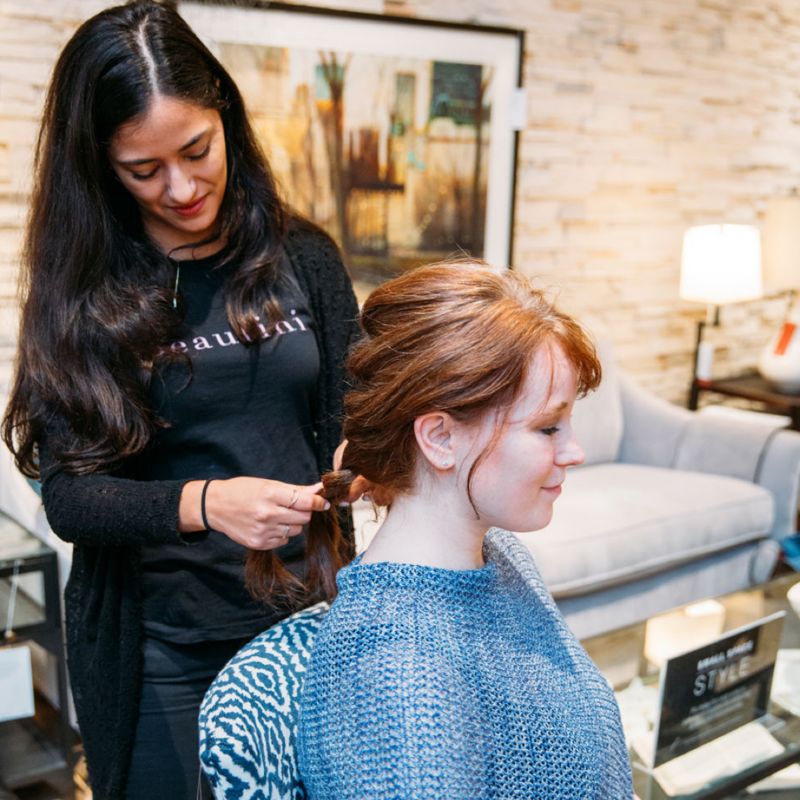 Attendees gets their hair styled