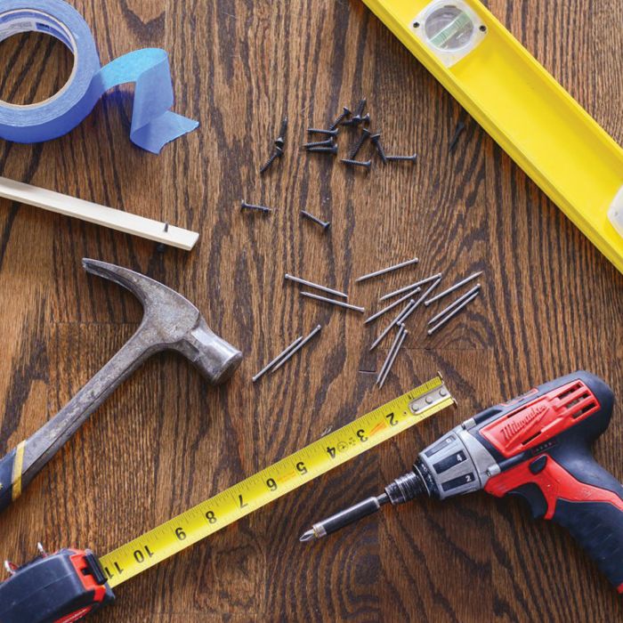 tools needed for photo wall hanging: hammer, ruler, nails, measuring tape, power drill