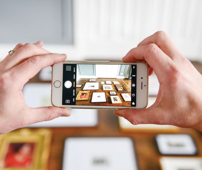 Phone taking a picture of frames design.
