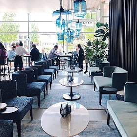 sophisticated barrel style chairs inside The Table at Crate