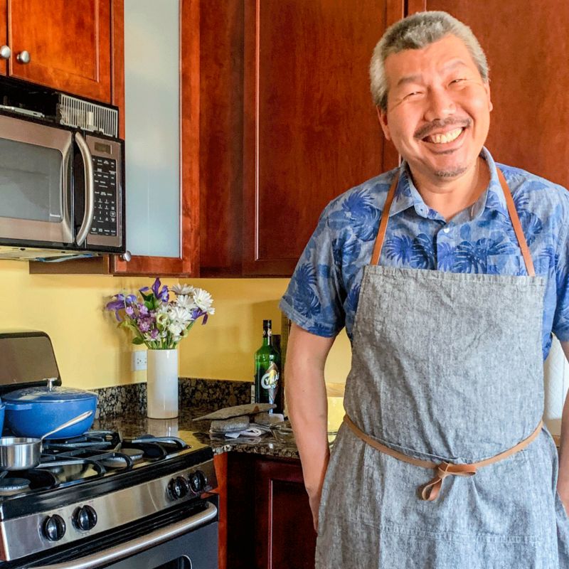 Chef Bill Kim smiling in his kitchen