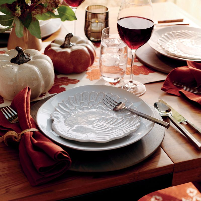 modern white dinnerware an antique Thanksgiving-themed serving platter