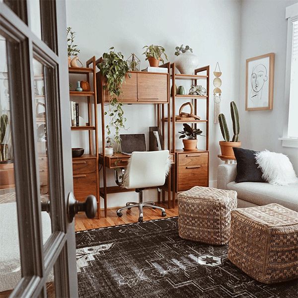 Desk and home office space decorated with assortment of plants