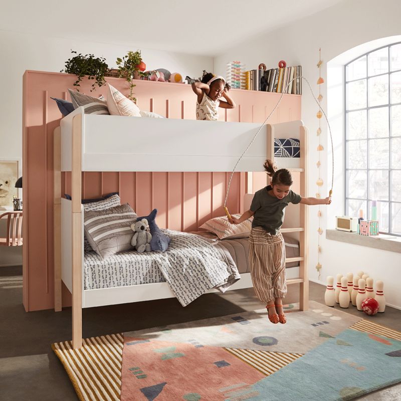 Two girls playing in bedroom
