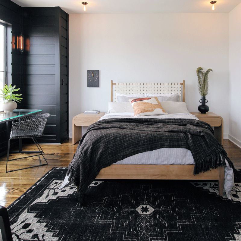 Angled view of bed and side tables