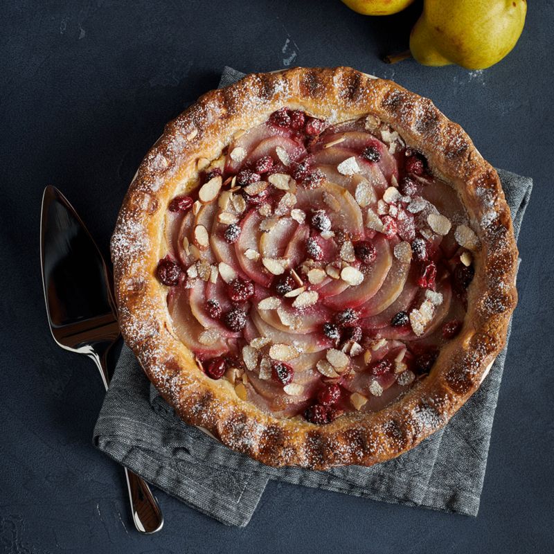 Baked apple cherry and walnut pie with pastry server