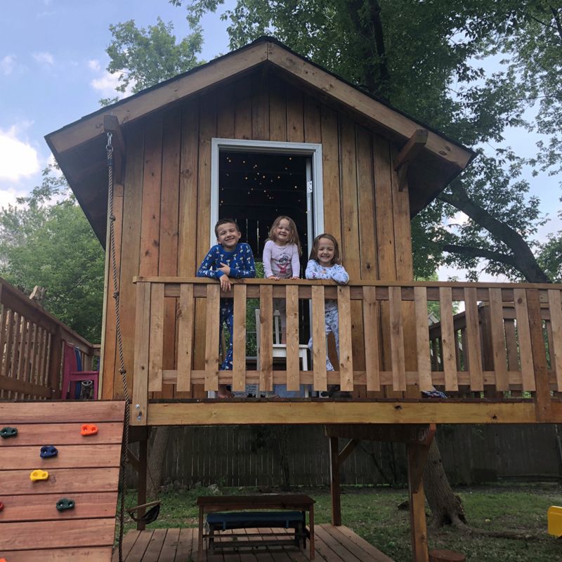 Kids outside of treehouse