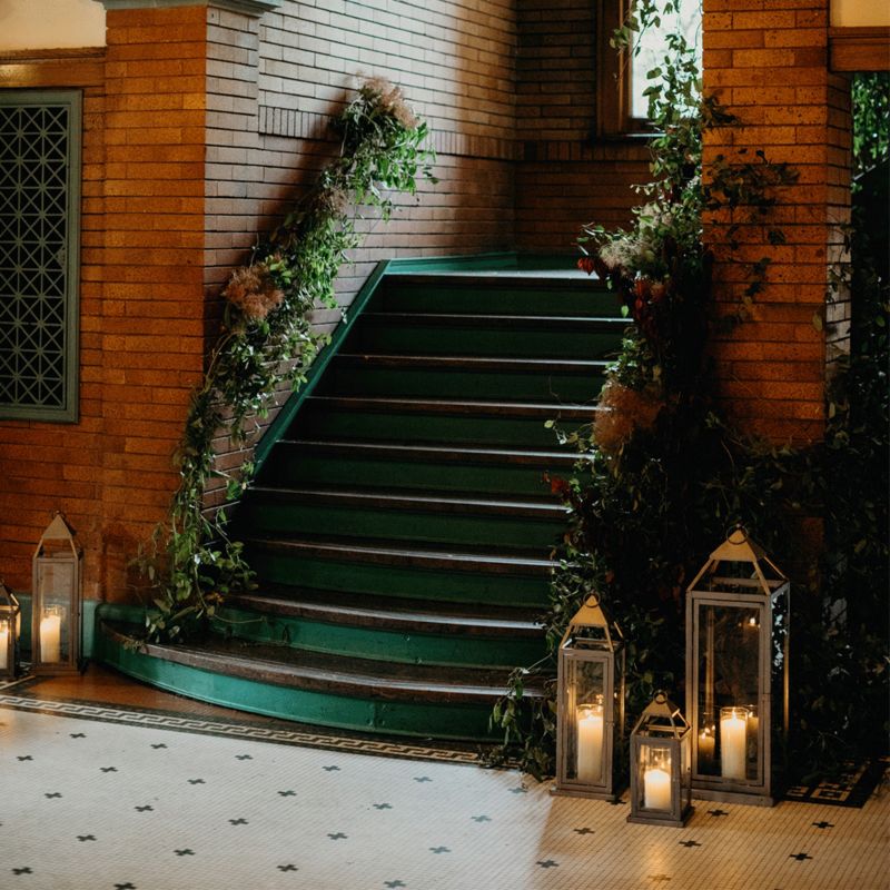 Staircase decorated with lanterns and flowers