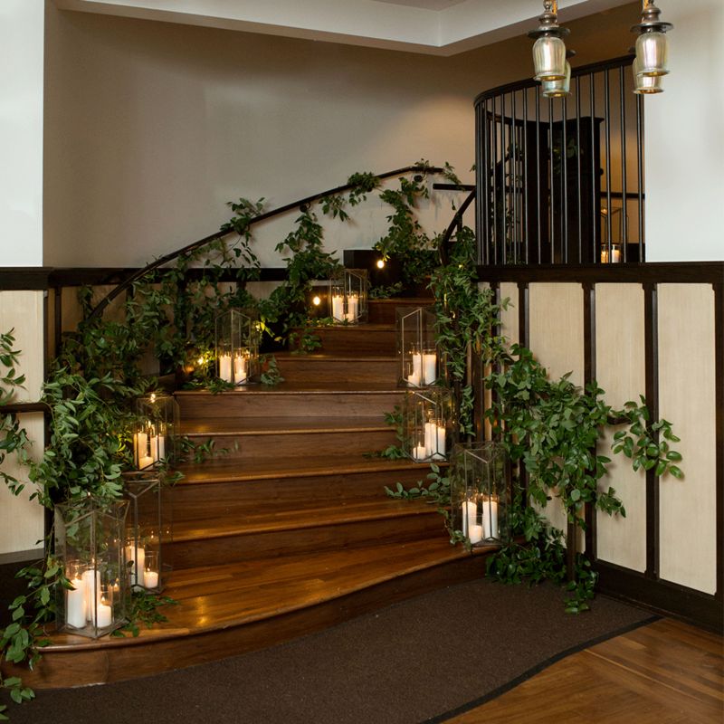 Staircase decorated with lanterns and flowers