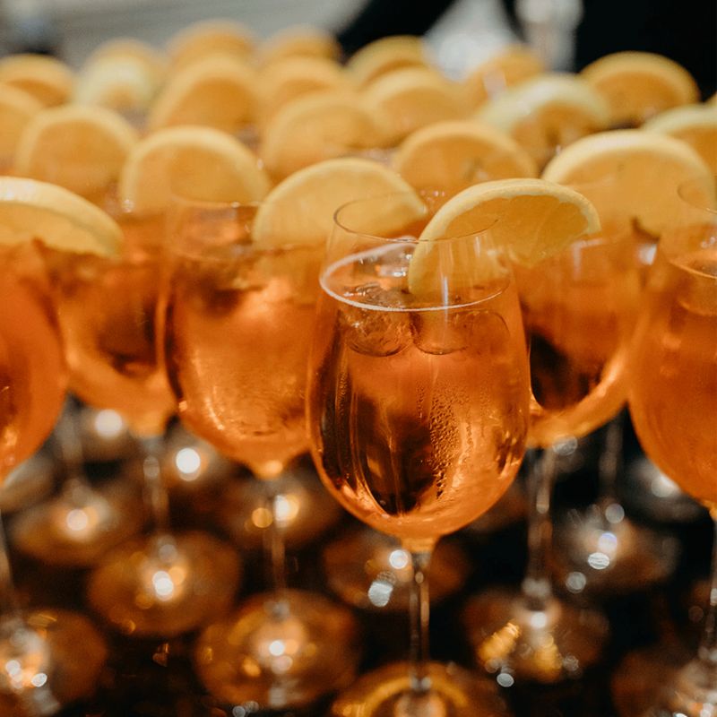 Picture of wine glasses with orange slice on rim