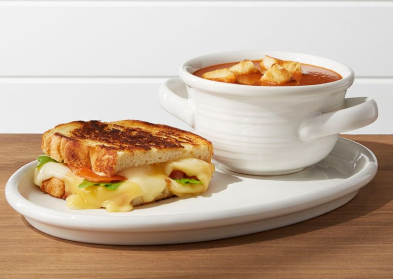Sandwich and bowl of soup on plate