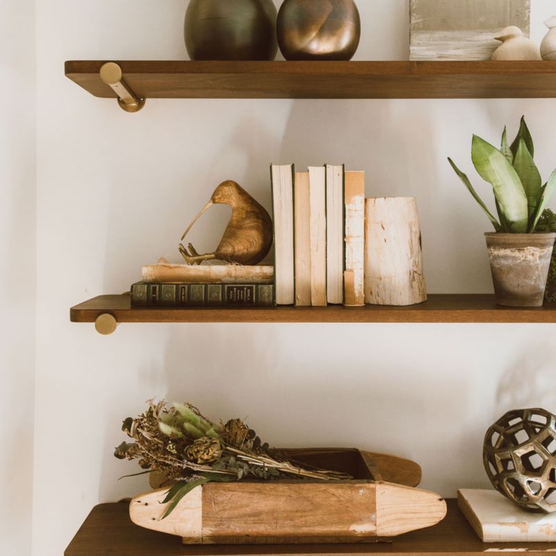 Riggs wall shelving decorated with books, plants and decor