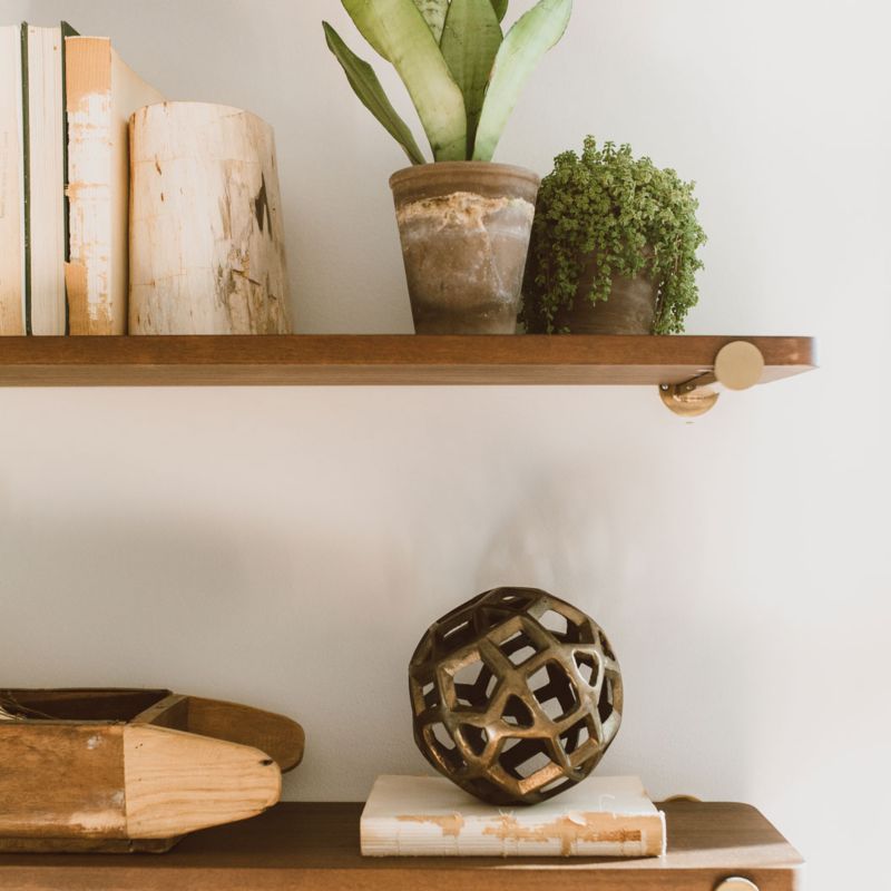 Riggs wall shelving decorated with books, plants and decor