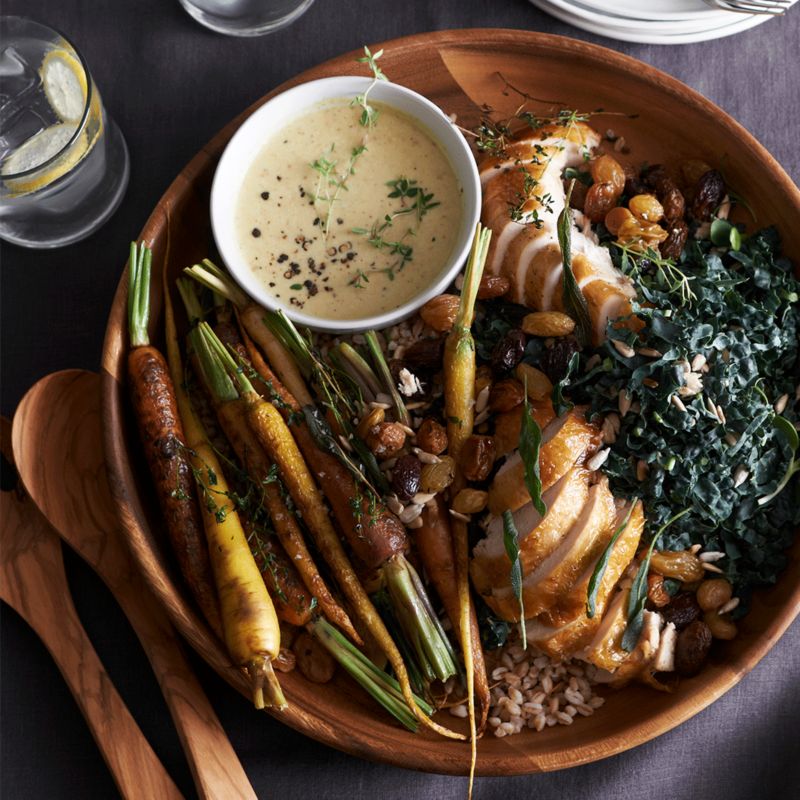 Round wood tray filled with vegatables and soup