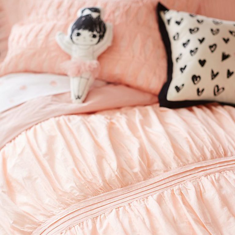 Pink voile comforter with ballerina-shaped throw pillow